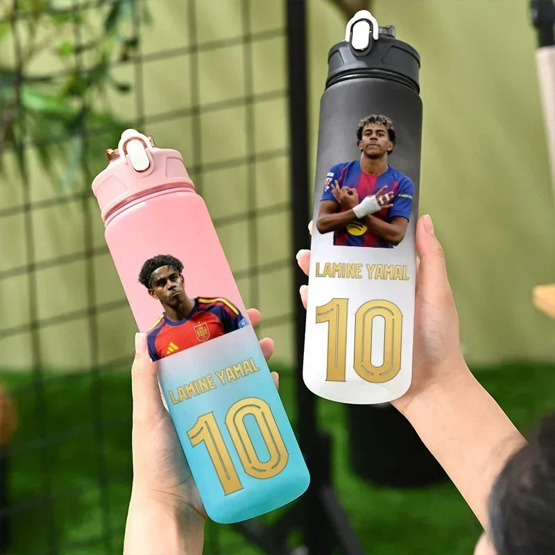 Two custom water bottles held in hands, featuring a printed photo of soccer player Lahmine Yahal with the number 10. One bottle is pink and blue, and the other is gray and white.