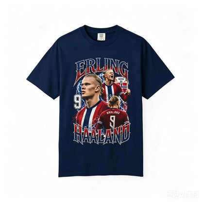 A navy blue short-sleeve t-shirt featuring a large graphic print of Erling Haaland, including his name, number 9, and football player photos, displayed against a plain white background.
