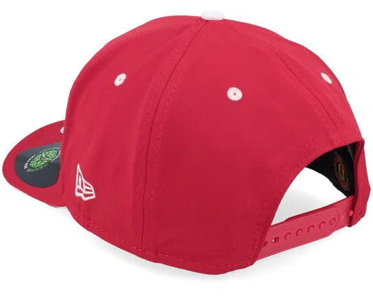 Red Manchester United cap with logo on a white background