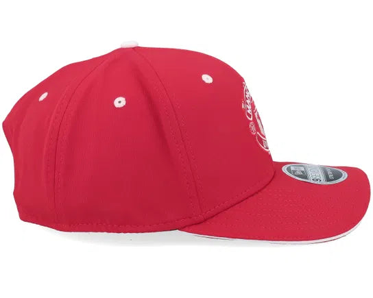 Red Manchester United cap with logo on a white background