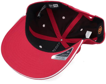 Red Manchester United cap with logo on a white background