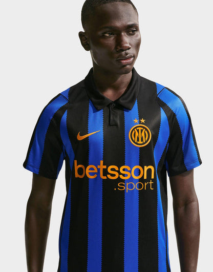 A man wearing a Nike Inter Milan 2026/27 Stadium Home Dri-FIT Soccer Replica Jersey with blue and black vertical stripes, featuring the Inter Milan crest and Betsson sponsor logo.