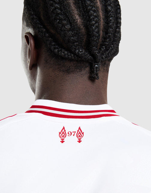 Back view of a person wearing a white adidas Liverpool FC 26/27 Away Jersey with red stripes on the collar and a red graphic with the number 97 on the upper back, against a light gray background.